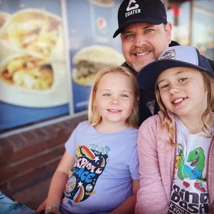 a man and two children
