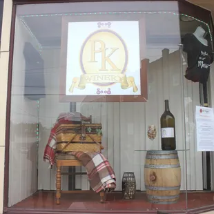 a display of wine bottles and barrels