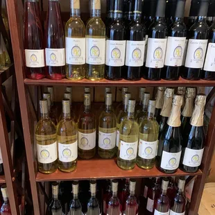 a shelf full of wine bottles