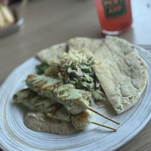 Chicken skewer plate and non alcoholic Cranberry beverage