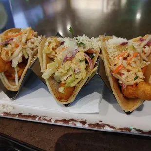 three fish tacos with slaw and coleslaw slaw