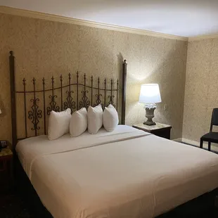 The bed in the king balcony room