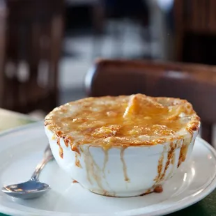 a pie on a plate with a spoon