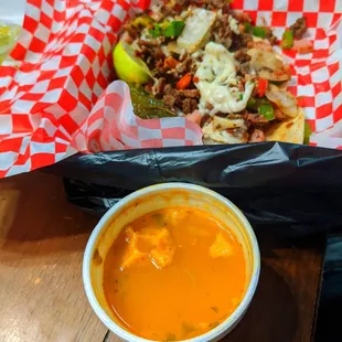 a bowl of soup and a sandwich