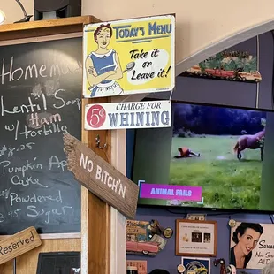 a chalkboard with a sign that says home, take it to love, and a sign that reads, &apos;