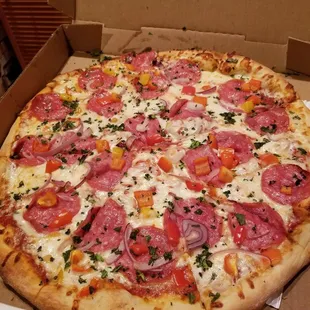 Make your own pizza, with salami, bell pepper, and onion.