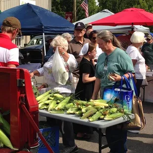 a woman selling corn