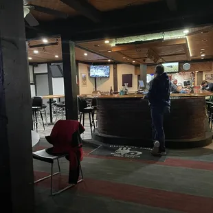 a man standing at a bar