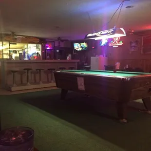a pool table and bar
