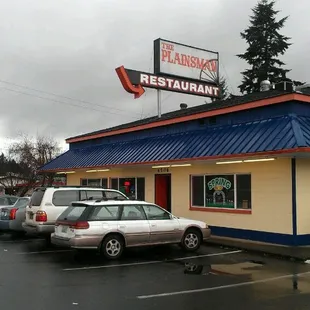 cars parked in front of the restaurant