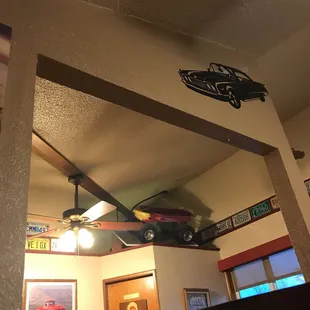 a car suspended from the ceiling