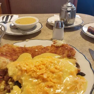 Yummy egg cheese mushroom and ham omelette with hollandaise sauce!