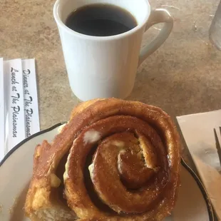 Home made cinnamon roll and coffee $4