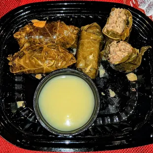 Dolmadakia: Grape leaves, lamb &amp; beef, rice, Avgolemeno sauce (G/D). $8