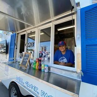 a man behind a food truck
