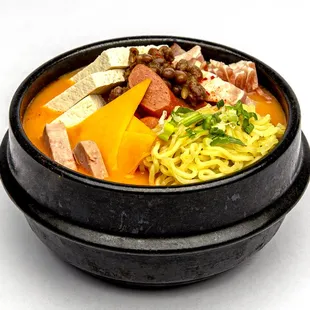 Spicy Sausage Casserole-Korean traditional Bu Dae jJI Gae with cheddar cheese, baked bean, sausage, spam, bacon, pork belly, tofu, kimchi,