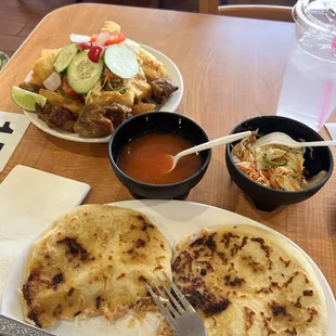 Pupusas de chicharron con queso y yuca frita con chicharron. What a treat!!