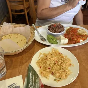 The breakfast platter with tortillas and a side of rice