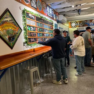 a group of people at a bar