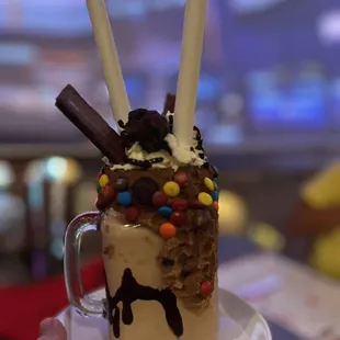 a milkshake with chocolate and candy