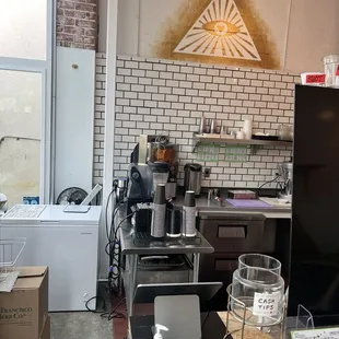 a kitchen with a counter and a refrigerator