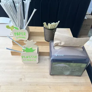 a variety of paper straws on a table