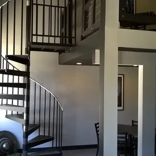 Spiral stair to the upstairs seating area