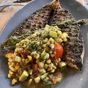 One of the fish of the day - Grilled Branzino with a pesto sauce and succotash