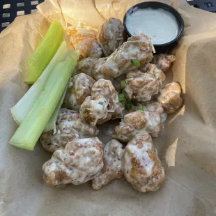 Extra crispy garlic parmesan chicken wings with a side of blue cheese