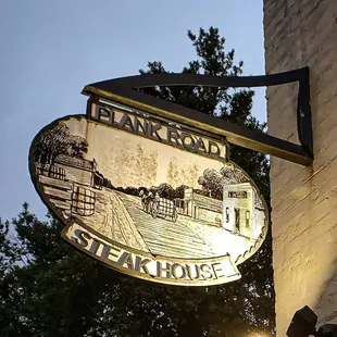 a sign for plank road steak house