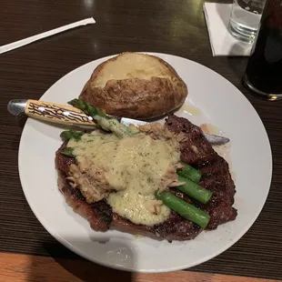 Ribeye with Oscar lump crab and asparagus with baked potato