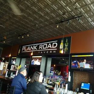 customers sitting at the bar