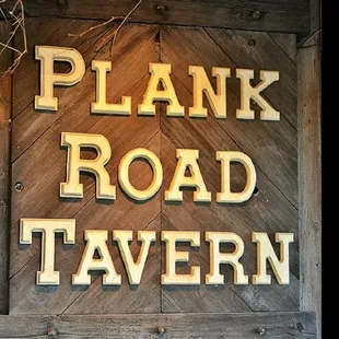 a sign for plank road tavern