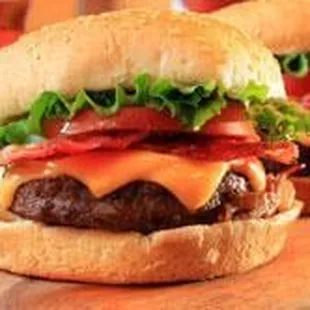 two cheeseburgers with bacon and lettuce