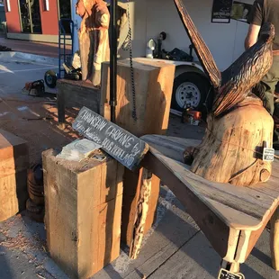 This artist uses a chainsaw to create woodwork.