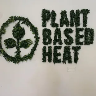 a sign that says plant based heat