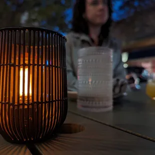 a candle on the table on the outdoor patio