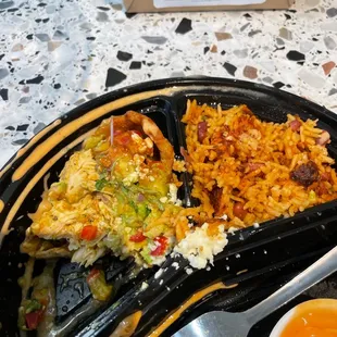 a plate of food with a fork and a bowl of soup