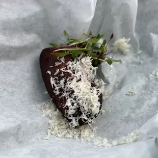 a chocolate bar covered in shredded coconut