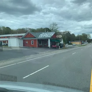 a red building on the corner of a street