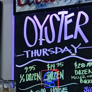 a neon sign for oyster thursday