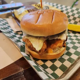 a chicken sandwich on a tray