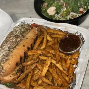 Philly cheesesteak , side salad