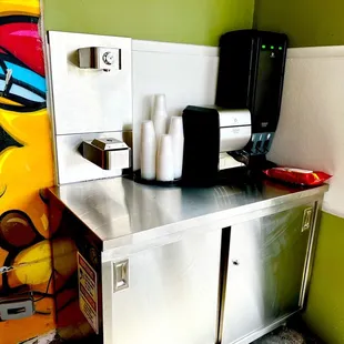 Self serve utensils, napkins, and water filtration system