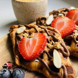 Strawberry Nocciola Croffle:
Pressed Croissants, Crema Di Nocciola, Strawberry, Almond Granola, Chia Seeds