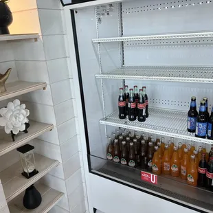 a refrigerator full of bottles of beer