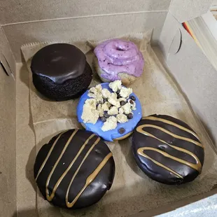 2 chocolate caramel donuts, 1 cookie monster, 1 witch brew donut, and 1 booberry donut