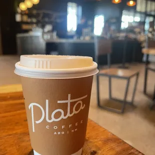 a cup of coffee on a table