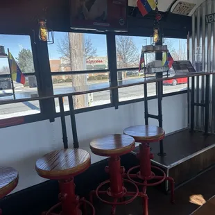 One side has a counter facing outside. Notice the creative lighting fixtures