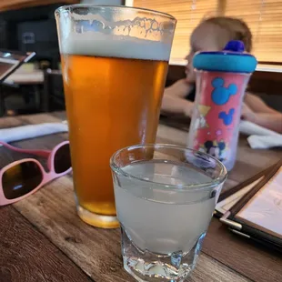 a glass of water and a glass of beer